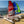 Load image into Gallery viewer, A Red and Blue MiniCRed and Blue MiniCat 310 Sports beside a MiniCat Guppy on the beach