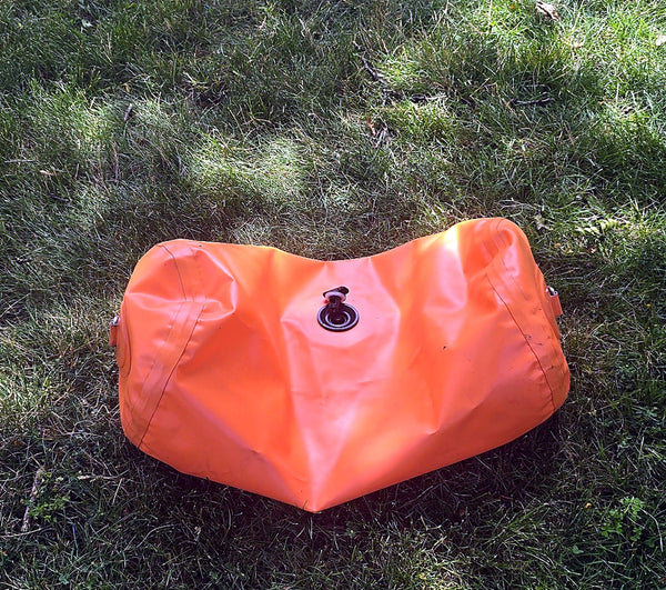 Orange inflatable seat accessory included with the 2021 Takacat T340LX demo boat
