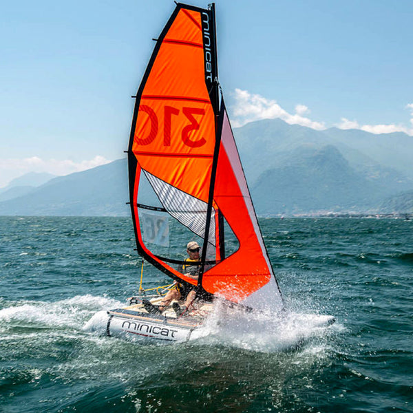 MiniCat 310 Sport sailing fast on the open water