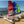 Load image into Gallery viewer, A Red and Blue MiniCRed and Blue MiniCat  310 Sports beside a MiniCat Guppy on the beach
